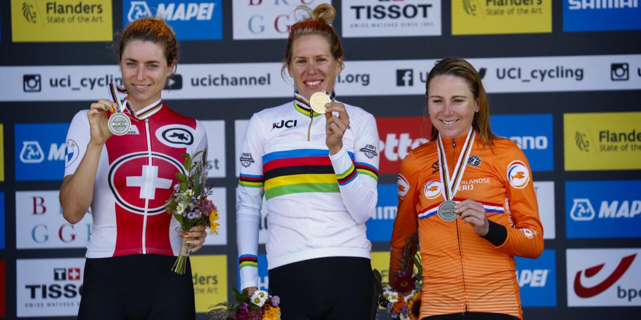 Annemiek van Vleuten in rainbow jersey on podium with Marlen Reusser and Ellen van Dijk at 2021 World Championships ITT